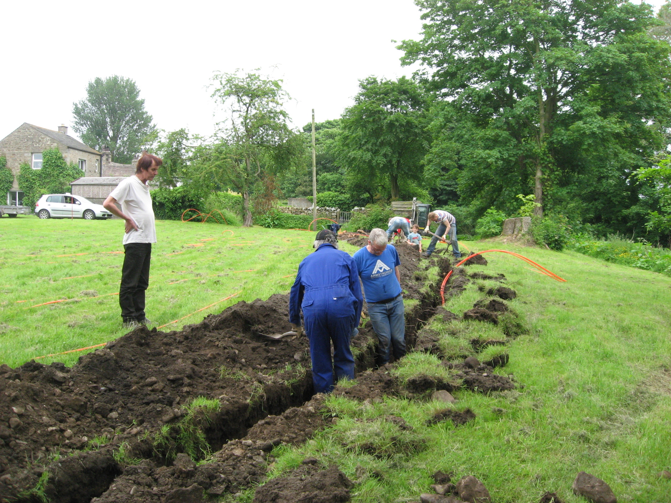 Digging the B4RN fibre optic cable, Wennington Green.